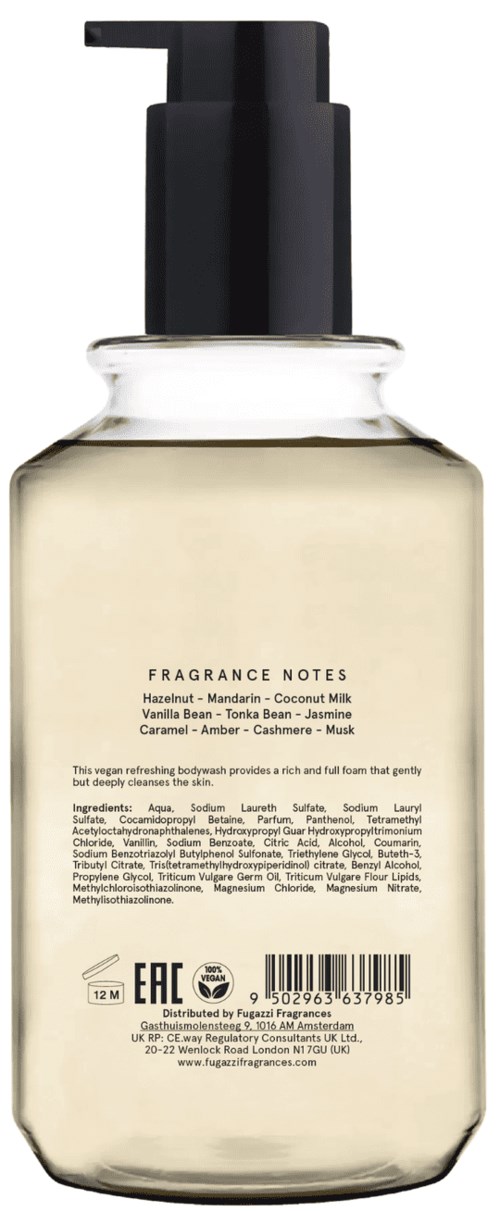 A clear bottle with a black pump top, containing a light-colored liquid perfume. The label lists fragrance notes and ingredients.