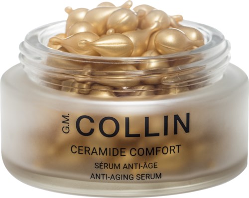 A jar of anti-aging serum with gold-colored capsules on top, labeled Collin Ceramide Comfort.