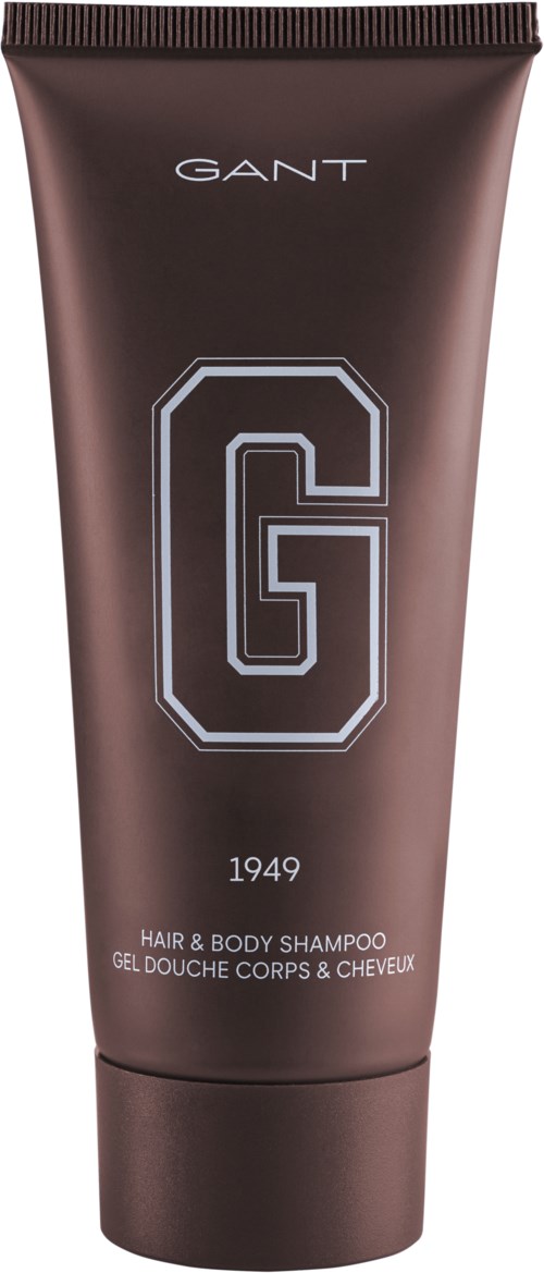 ruskea putkilasi GANT-logolla, pieni teksti ja suuri 'G'. Se on shampoo hiuksille ja vartalolle.