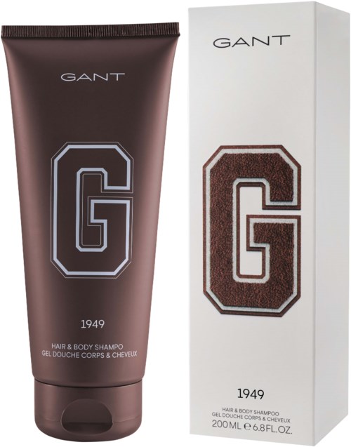 En mørk brun tube og hvit eske med GANT hår- og kroppsshampoo med en stor G-logo og året 1949.