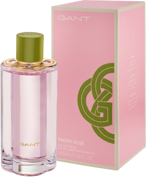 Pink perfume bottle with a green cap, next to a pink box with green and white design, labeled GANT Preppy Rose.
