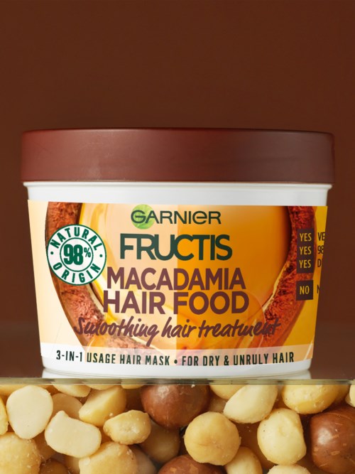 Garnier Fructis Macadamia Hair Food i en boks, med hebraisk tekst for bruk for sunt, glansfullt hår.