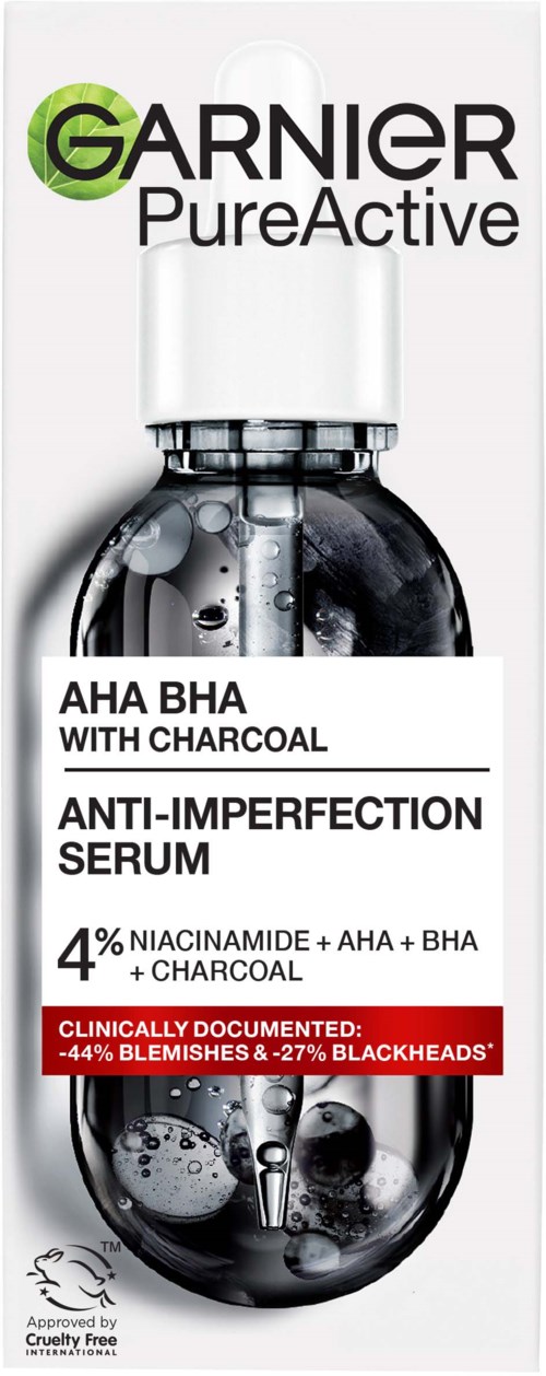 A skincare product bottle with Garnier Pure Active branding, labeled as anti-imperfection serum with charcoal and 4% niacinamide.