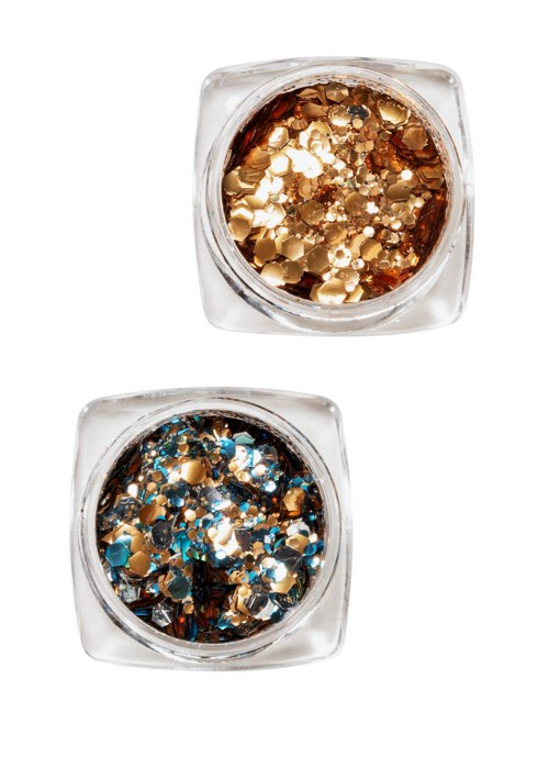 Två små burkar med glitter, ett i guld och ett i blått med guld. De glittrar och är runda och glansiga.