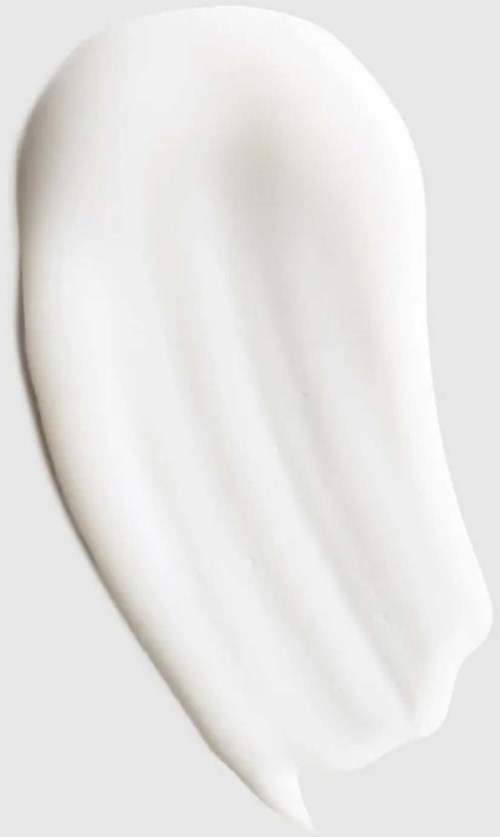 En hvit, bøyd stripe av krem eller lotion på en grå bakgrunn. Den virker glatt og skinnende.