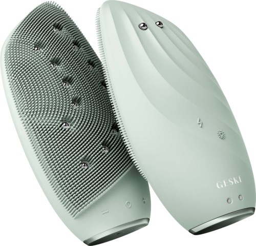A white handheld device with a textured cleaning surface and a smooth, rounded back, likely an electric scrubber or cleaner.