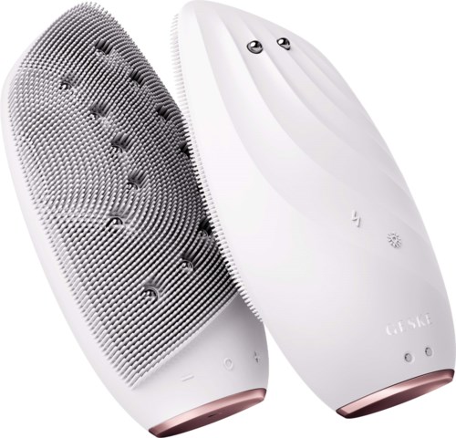 En vit fotmassager med en texturerad och slät sida, samt kontrollknappar på toppen.
