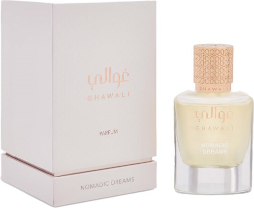 A perfume bottle and box, label says Ghawali Nomadic Dreams, light-colored liquid inside.