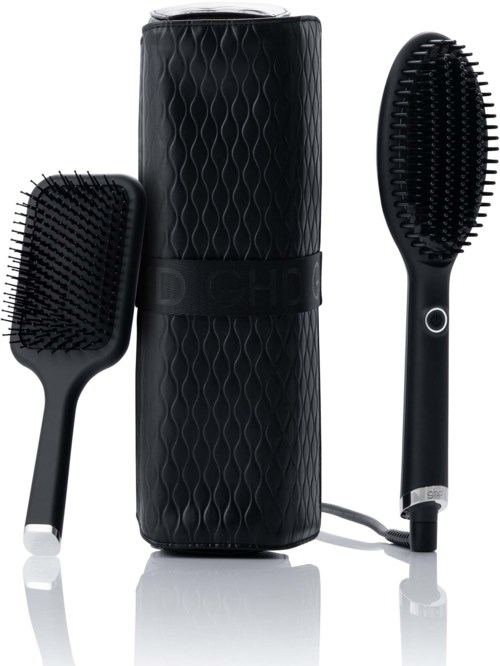 Two black heated hairbrushes with a cylindrical case are shown, one with a round button and a power cord.