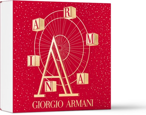 Omslaget har en röd bakgrund med guld- och vitfärgad text. Den visar varumärket Giorgio Armani och en dekorativ design.