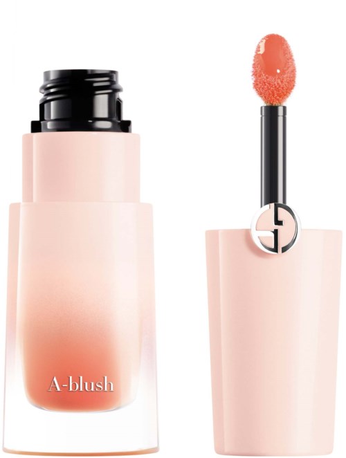 En blushflaska och applicator med mjuk rosa färg och snygg design.
