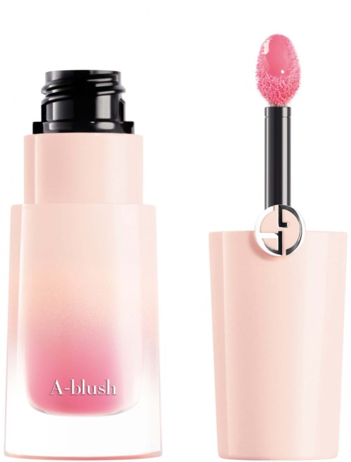 Läppglans och blushflaska med rosa och svarta delar, med en fluffig applikatorsborste.