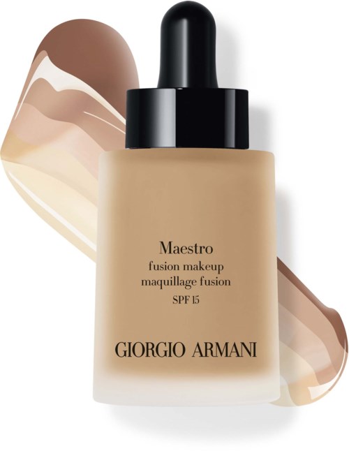 En Giorgio Armani foundationflaske med sort pipette, foran en farveskala af forskellige hudtoner.