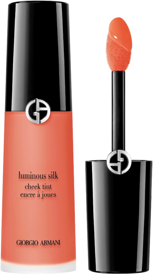 Błyszczyk do ust Giorgio Armani w pomarańczowym odcieniu z czarnym aplikatorem.