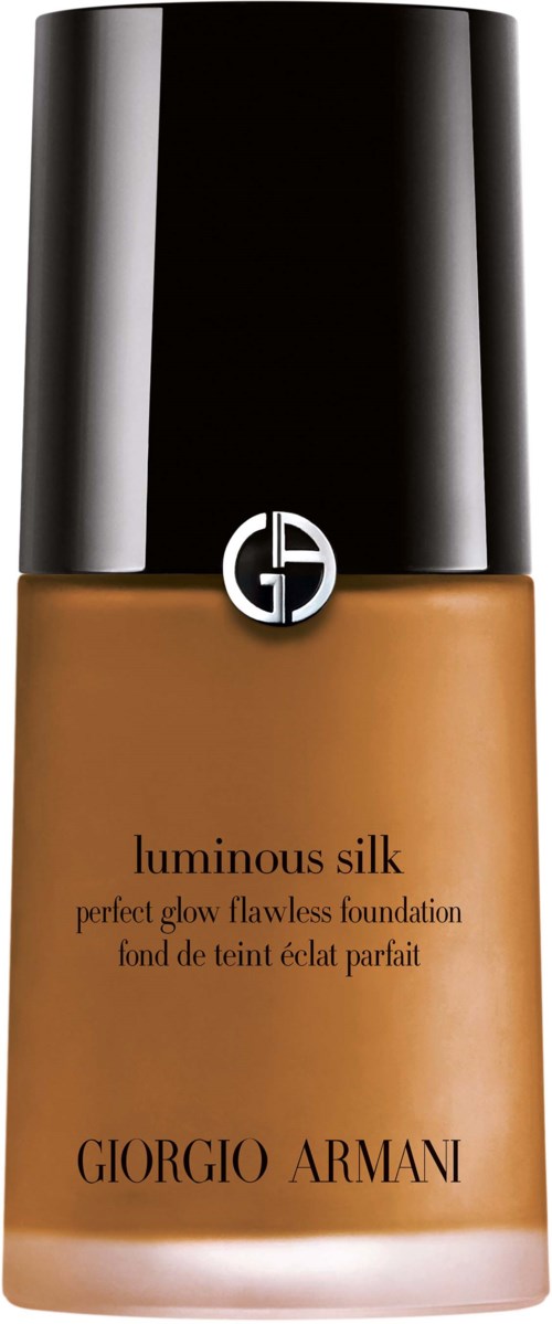 A bottle of Giorgio Armani luminous silk foundation with a black cap and brown liquid inside.