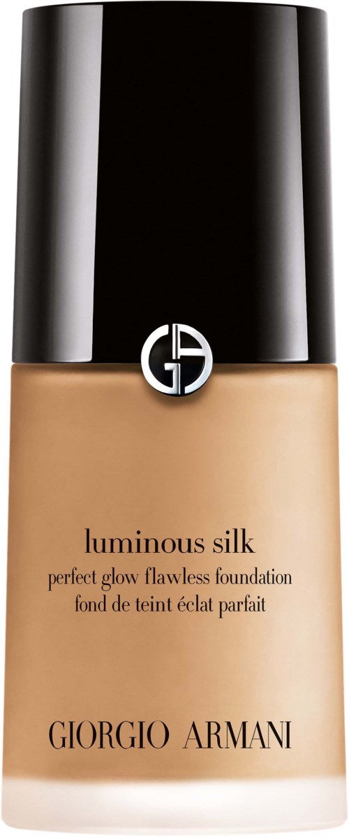 Eine Flasche Giorgio Armani luminous silk Foundation mit schwarzem Deckel und beige Flüssigkeit.