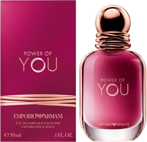 A pink perfume bottle with a shiny cap, next to a matching pink box with gold and white text.