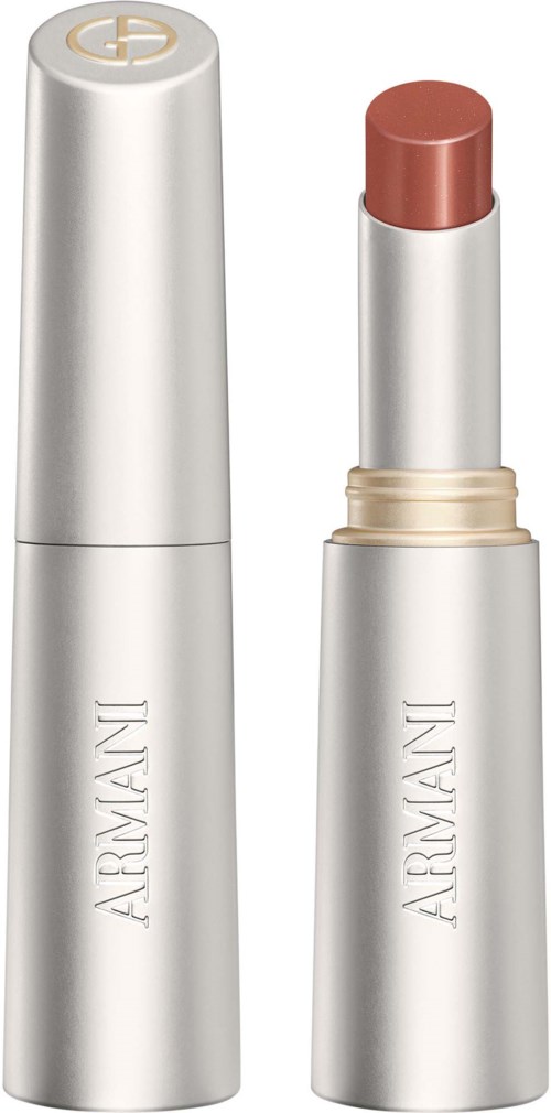 En silver läppstiftsrör med beige band och en makeupfickska inne.