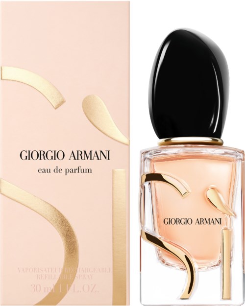 A Giorgio Armani perfume bottle and box, both with abstract gold-colored designs and soft pink liquid inside.