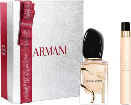 Giorgio Armani parfymflaska med svart lock, bredvid en vit förpackning med röd rosett och Armani-logga.