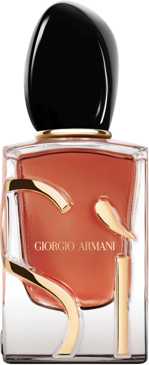 A glass perfume bottle with black cap, containing pinkish liquid and gold decorative letters, Giorgio Armani.