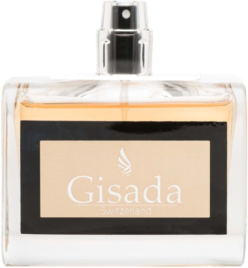 En parfymflaska med tydlig glasdesign, svart etikett och spraymunstycke, märkt 'Gisada Switzerland' med beige- och svartfärger.