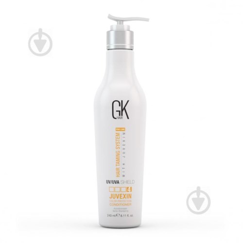 En vit pumpflaska som är märkt som balsam för hår, från GK Hair, Juvexin och UV-/färgbeskydd.