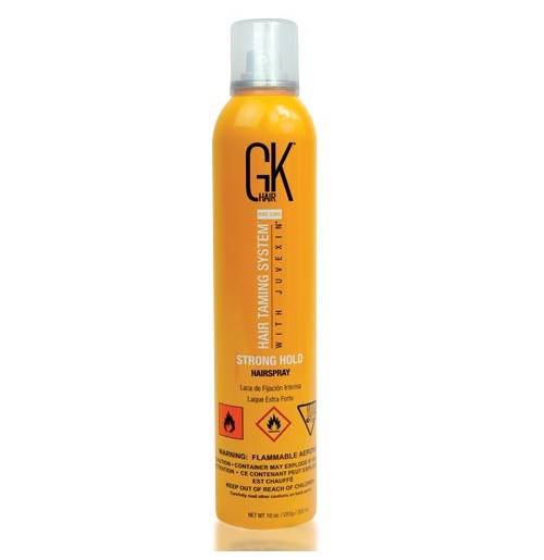 Keltainen GK-hairspray-ruisku, jossa on mustaa ja oranssia tekstiä ja varoitusmerkkejä, suunniteltu vahvistamaan hiuksia.