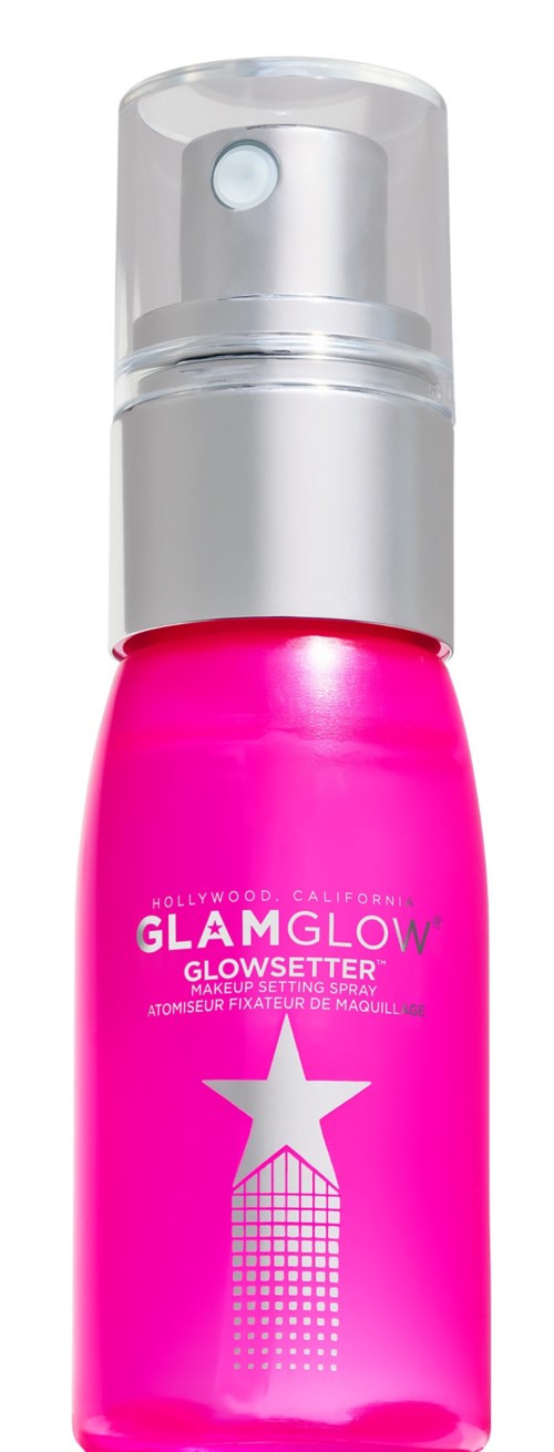 En ljusrosa flaska med en vit stjärna och rutnät, märkt GLAM GLOW, typisk för en kosmetisk produkt.