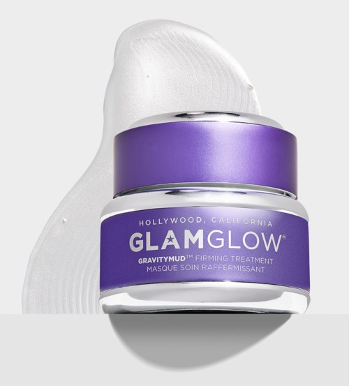 Lila burk märkt GlamGlow, med vit kräm på vit bakgrund, som visar hud- eller ansiktsbehandling.