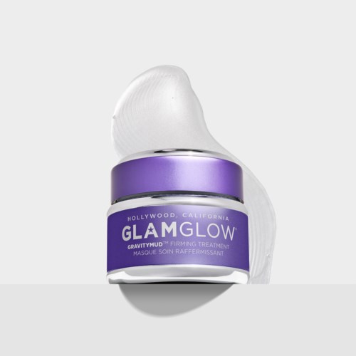 En lille krukke med GlamGlow Gravitymud fasthedsgivende behandling med lilla etiket og hvid creme.