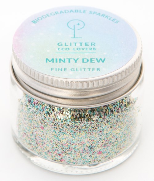 Liten burk med fint, flerfärgat glitter som heter Minty Dew, märkt som miljövänligt och biologiskt nedbrytbart glans.