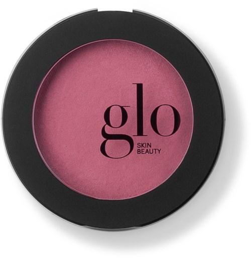 Een ronde roze blush in een zwart opbergdoos met de tekst 'glo SKIN BEAUTY'.