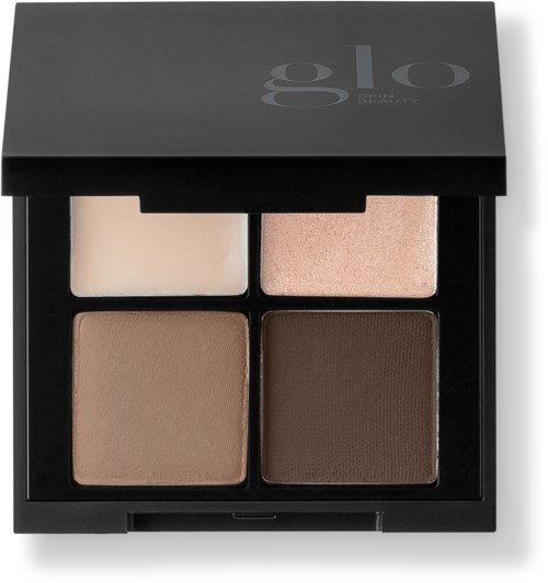Een make-up palet met vier tinten: licht, beige, medium en donkergroen. Het zit in een zwarte doos.