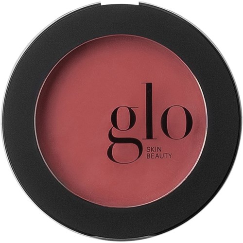 En rund blush-compact med sort kant og rosa midte. Den har teksten "glo SKIN BEAUTY".