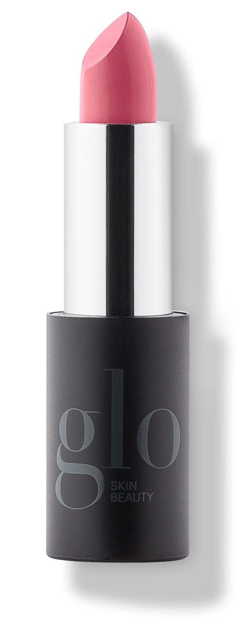 Pink lipstick in a black and silver tube, standing upright with shadow on a white background.