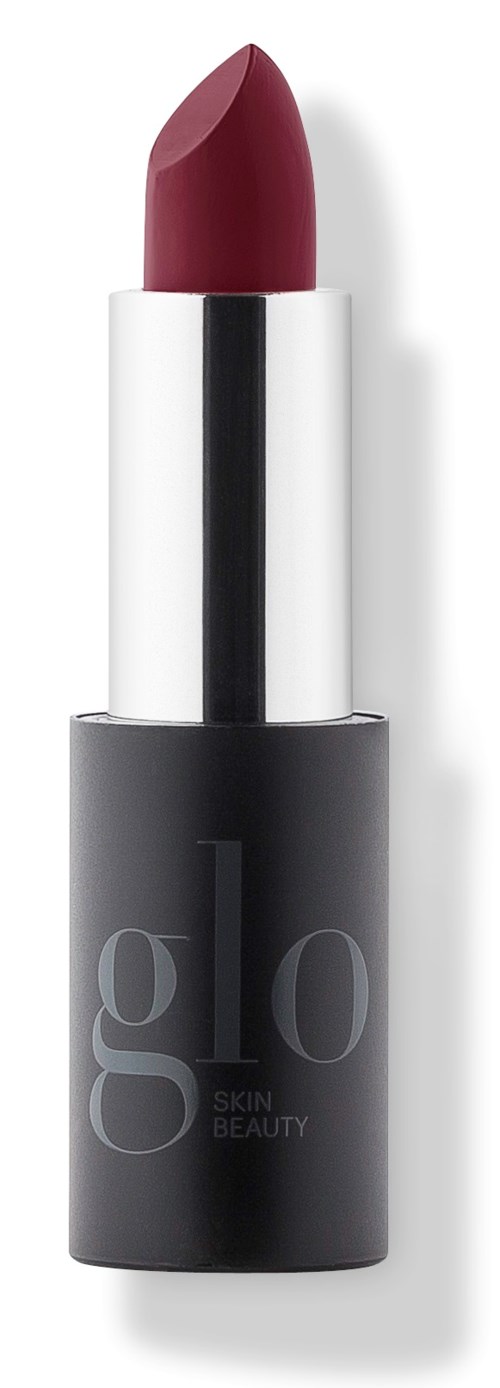 A lipstick with a dark red color in a black and silver tube.