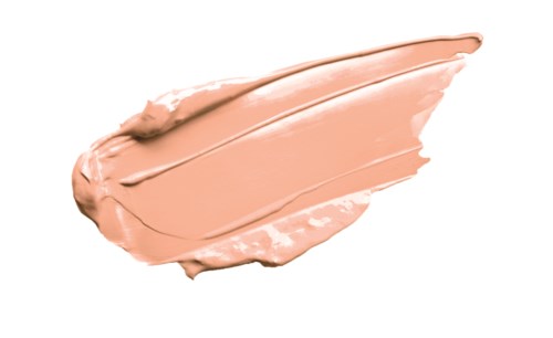 Een streek van beigekleurige crème of foundation op een witte achtergrond.