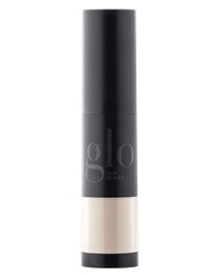 En svart cylindrisk tub med en genomskinlig del längst ner, möjligen en kosmetik- eller hudvårdsprodukt.