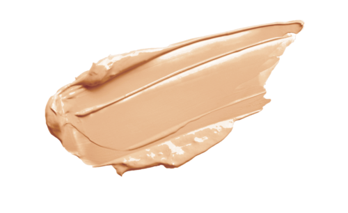 Een beige crèmepasta met een gladde, dikke textuur op een zwarte achtergrond.