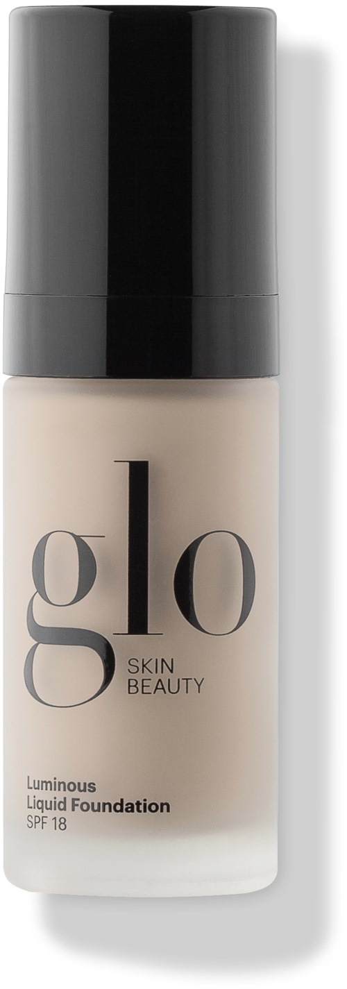Sävyvoidepullo, jossa musta kansi, merkinnät 'glo' ja 'Skin Beauty', SPF 18.