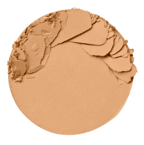 En rund beige pudder med noen knuste biter på øvre venstre side.