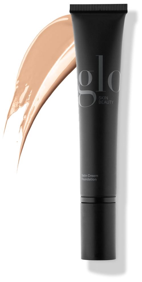 En svart tube med en beige krem ved siden av, merket 'skin camouflage foundation' for huddekning.