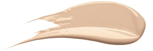 En beige væskemakeup-svamp på svart bakgrunn med en stråle som strekker seg ut.