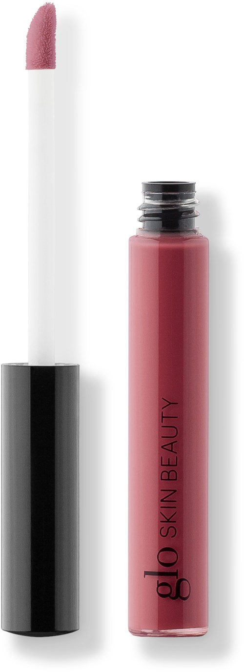 En läppglansrör med en vit borste och ett rosa gloss inuti. Röret är svart och rosa med texten "glo SKIN BEAUTY".