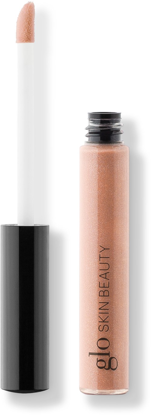 En läppglansflaska med locket borttaget, som visar aplikatorn och beige färgad gloss inuti.