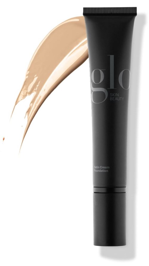 En svart tube med foundation med et beige strekk ved siden av.