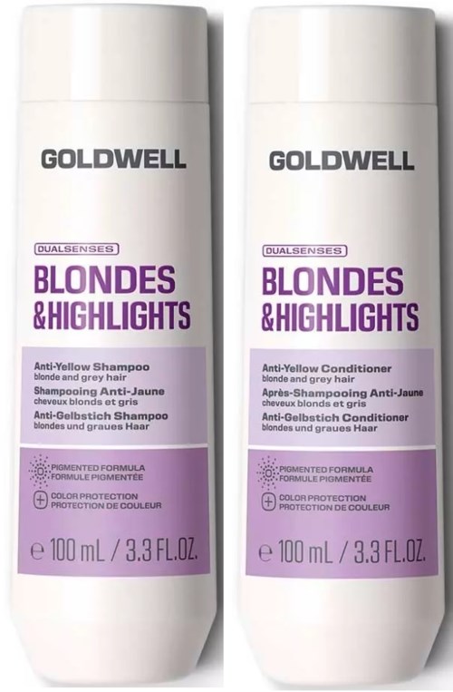 Två vita flaskor från Goldwell Blondess & Highlights hårvårdsprodukter, en för anti-gul schampo, en för anti-gul balsam.
