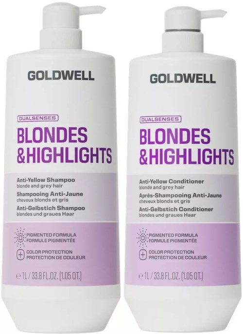 Två flaskor med Goldwell schampo och balsam för blondiner och ljusning, vita med lila och svart text.