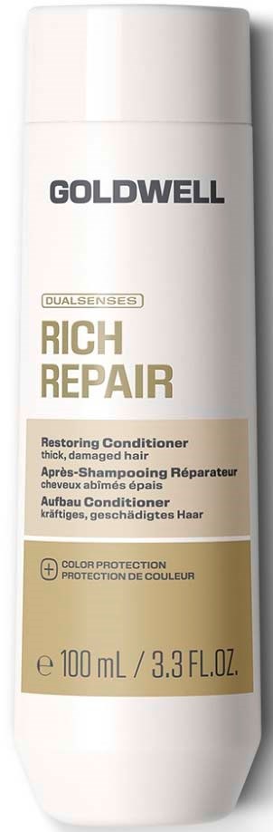 En vit flaska med Goldwell Rich Repair hårbalsam med beige och guldetikett.